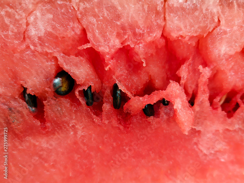 Obraz na płótnie Photo of the pulp of ripe red watermelon with black seeds w salonie