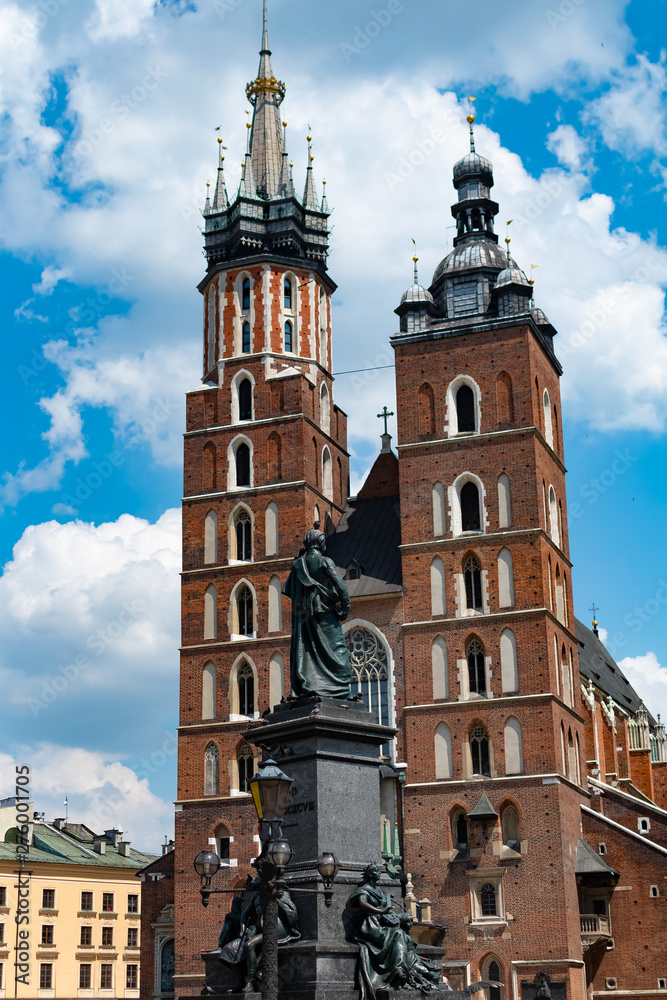 Saint Mary basilica and church of Saint Adalbert in main square of Krakow on a sunny day, Poland