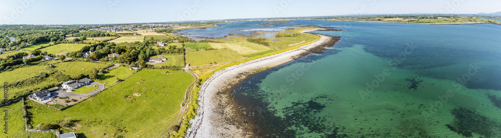 Panorama with Aerial view of Galway bay with farms and beach