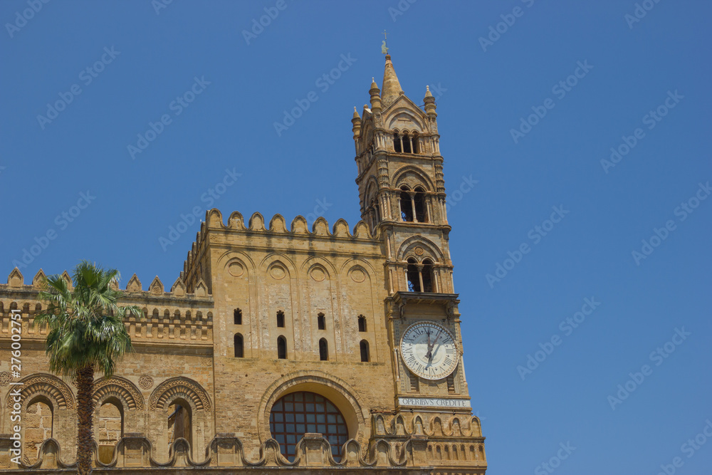 Detailed view at the historical cathedral of Palermo Sicily, back side of this medieval architecture with bell tower with clock