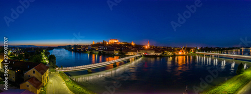 Castle on top of hill at night, aerial view of Ptuj, Slovenia in dusk
