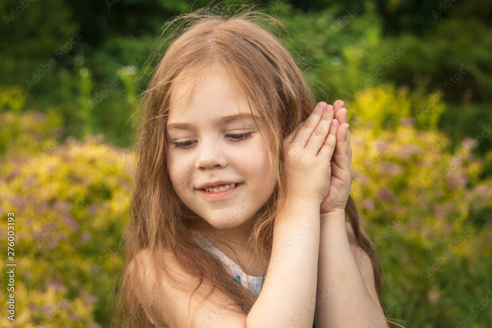 little girl in a flower field