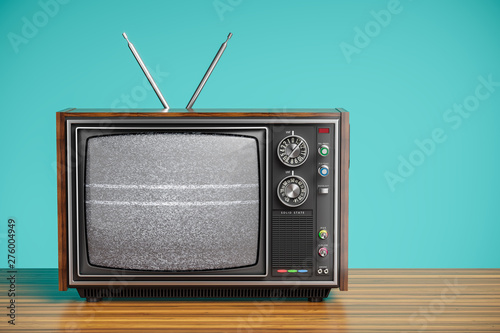 An old TV with a monochrome kinescope on wooden table. 3d photo