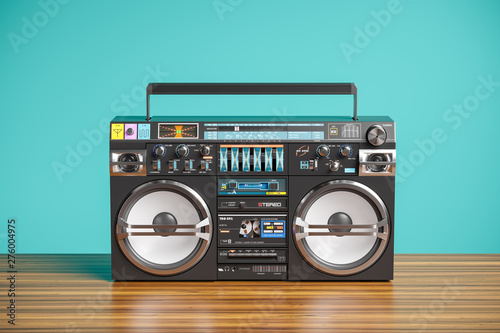 Boombox tape recorder player on wooden table. 3d