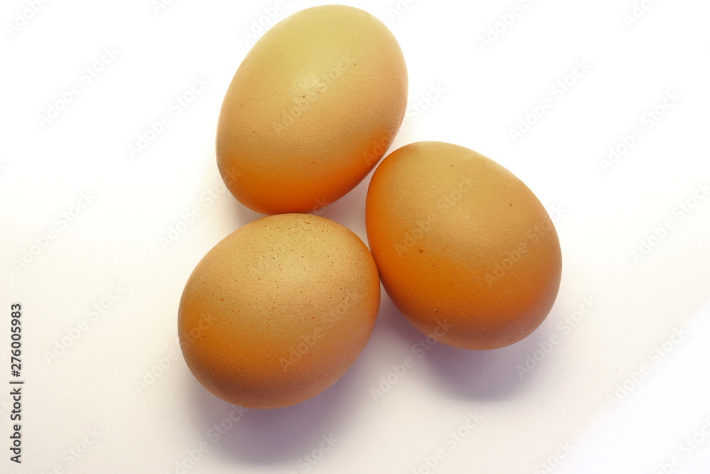 Closeup view of three eggs isolated on white background