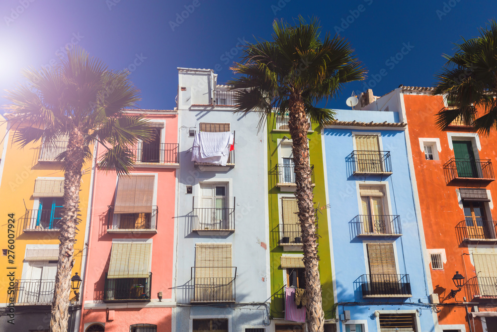 Naklejka premium Closeup facades of colorful houses in the street of the old village of Villajoyosa, Costa Blanca, Spain