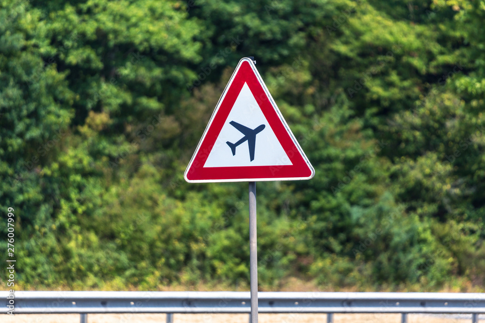 airplanes crossing street sign