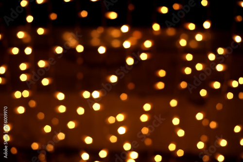 Golden abstract background with bokeh defocused lights