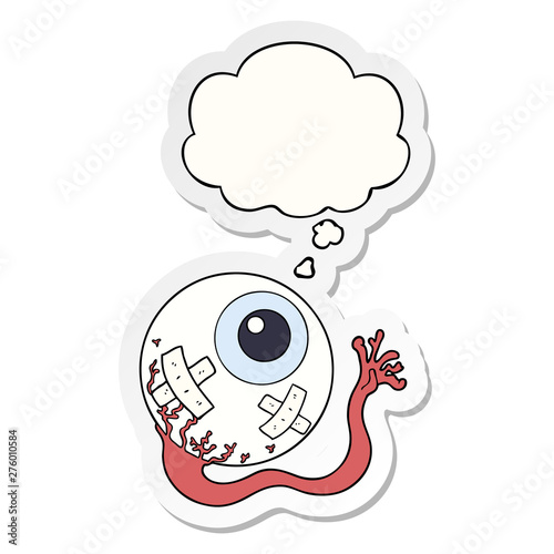 cartoon injured eyeball and thought bubble as a printed sticker