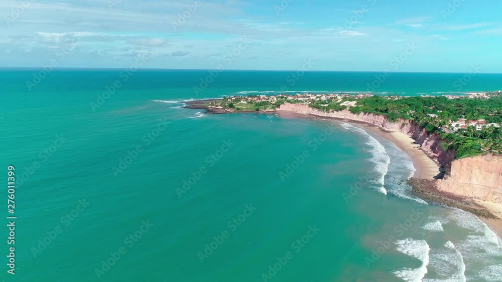 Summer ocean waves. Waves rolling. Blue wave on the sandy beach. Brazilian beach. Summer ocean waves. Waves rolling. Blue wave on the sandy beach. Brazilian beach.