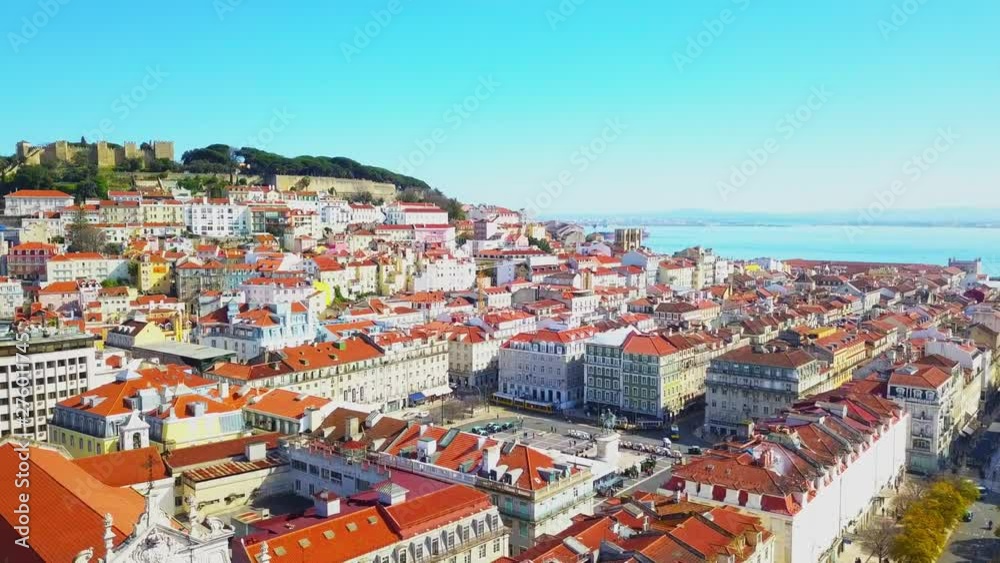 Panoramic aerial view of Lisbon on a beautiful summer day. Old town Red roofs Top place. City skyline, travel, adventure and destination concept