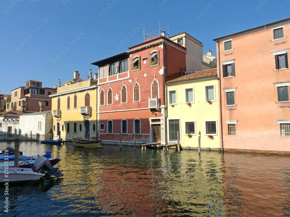 Typical houses of the Venetian lagoon overlooking a canal in the town of Chioggia - Italy