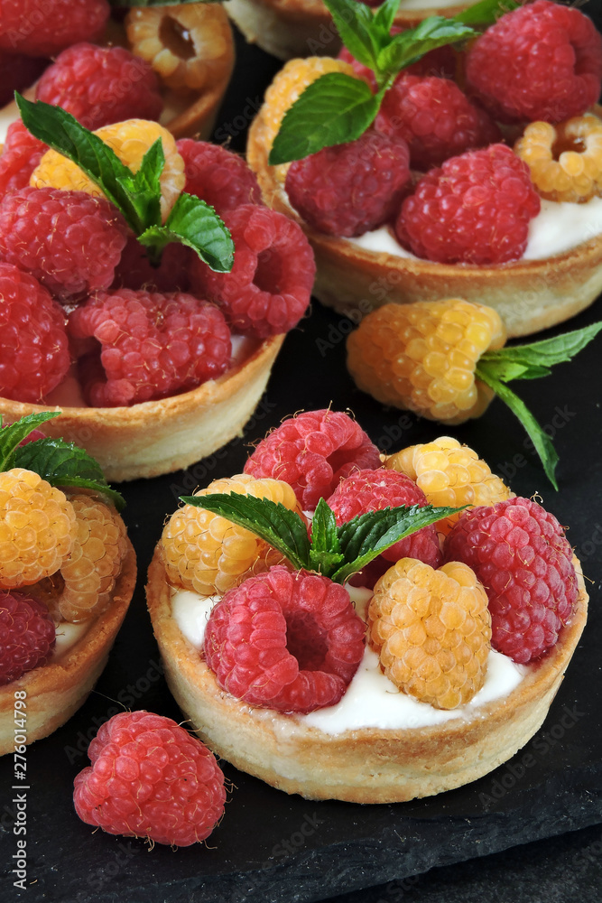 Tartlets with red and yellow raspberries. Keto diet. Keto dessert Tartlets with red and yellow raspberries. Keto diet. Keto dessert