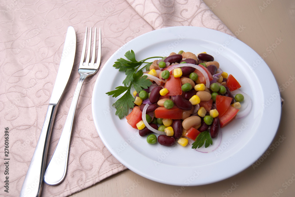 Healthy bean and corn salad on a white plate Healthy bean and corn salad on a white plate