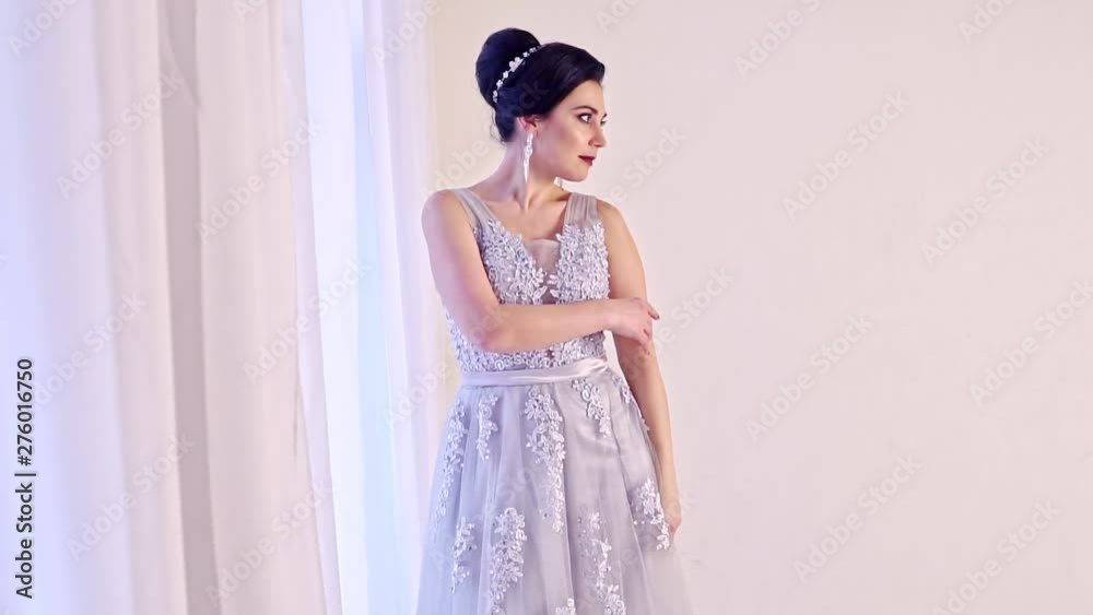 Fashion portrait of beautiful woman in elegant white dress. Fashion portrait of beautiful woman in elegant white dress.