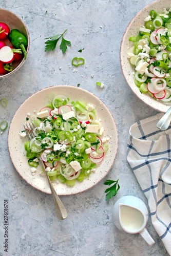 Healthy fresh salad with greenspring onion, light cheese served with greek yogurt. Top view with copy space. photo