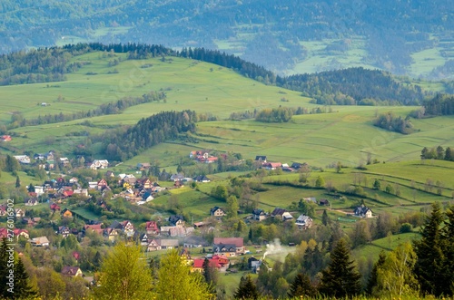 Beautiful spring mountain landscape. Nice villages in the valleys between the hills.