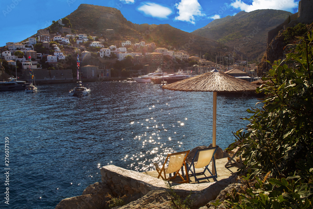 Fototapeta premium View of the sunbathing area and harbor of Hydra- greek island