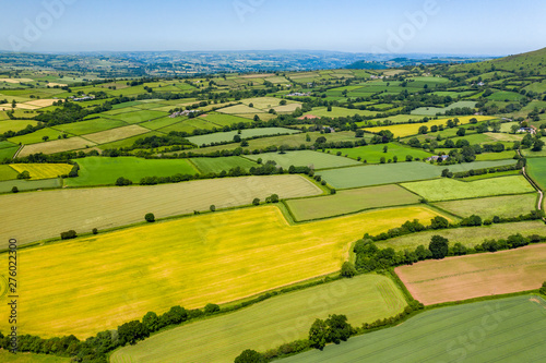 Aerial drone view of green fields and farmland in rural Wales