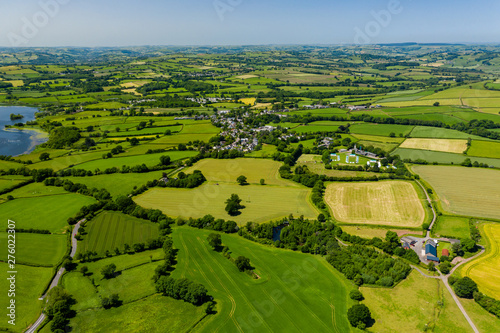 Fototapeta Naklejka Na Ścianę i Meble -  Aerial drone view of green fields and farmland in rural Wales