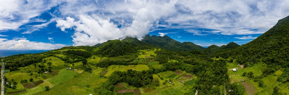 Aerial panorama of farmland on the slopes of the volcano Mount Hibok-Hibok on Camiguin island Aerial panorama of farmland on the slopes of the volcano Mount Hibok-Hibok on Camiguin island