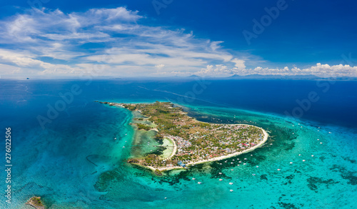 Aerial drone view of a small tropical island and surrounding coral reef (Malapascua) photo