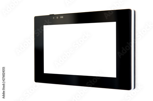 touchscreen tablet with a blank white screen and a black case mounted on a white wall to control smart home technology, close-up side view.