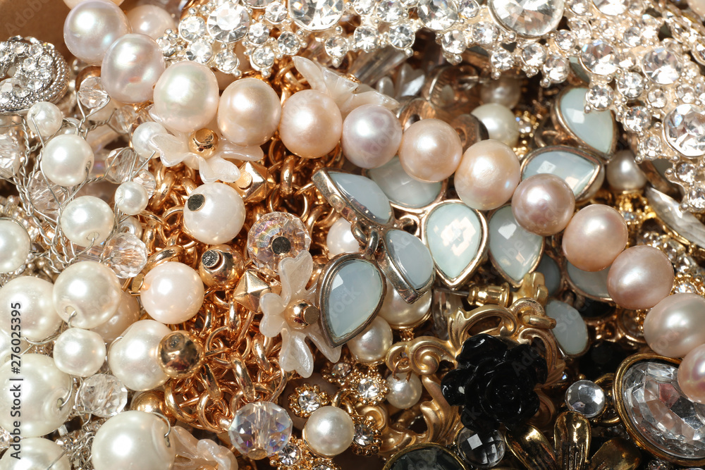 Different stylish jewelry as background, closeup view Different stylish jewelry as background, closeup view