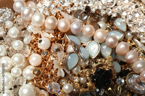 Different stylish jewelry as background, closeup view