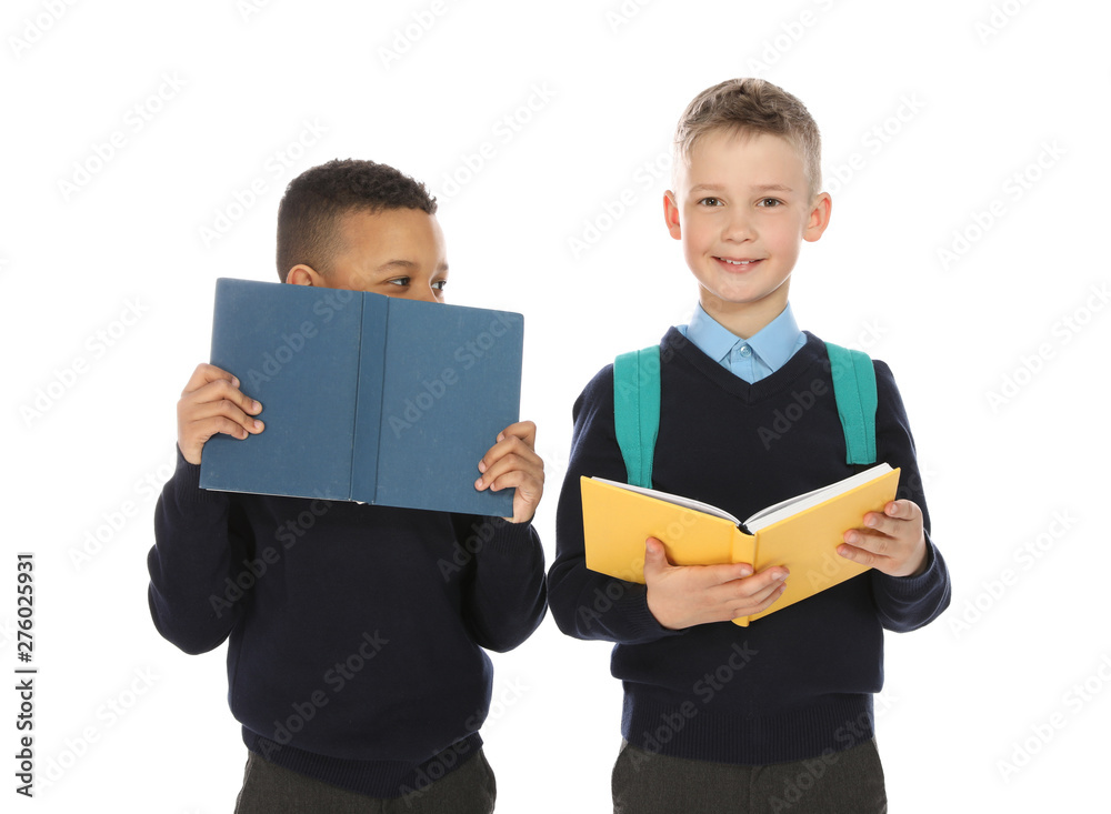 Portrait of cute children in school uniform with books on white background Portrait of cute children in school uniform with books on white background
