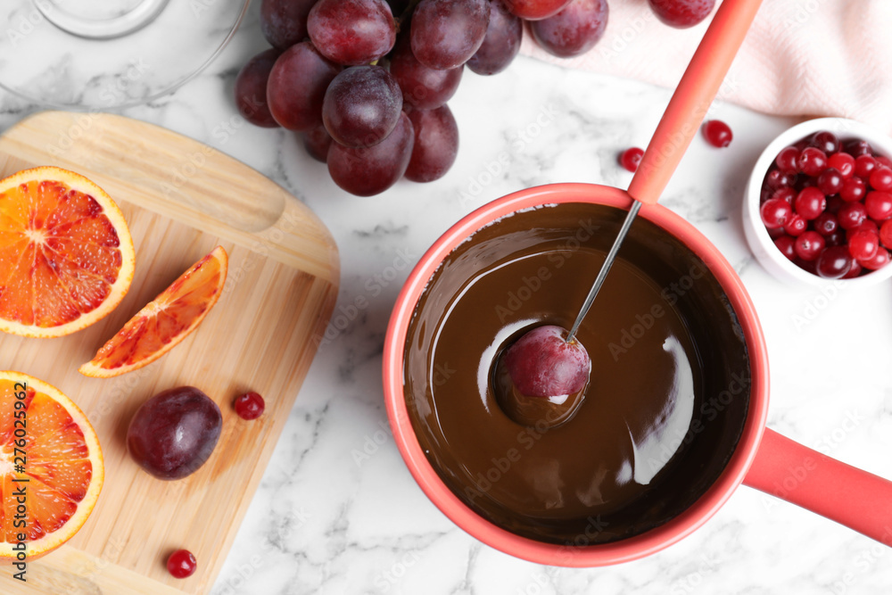 Flat lay composition with chocolate fondue on marble background Flat lay composition with chocolate fondue on marble background