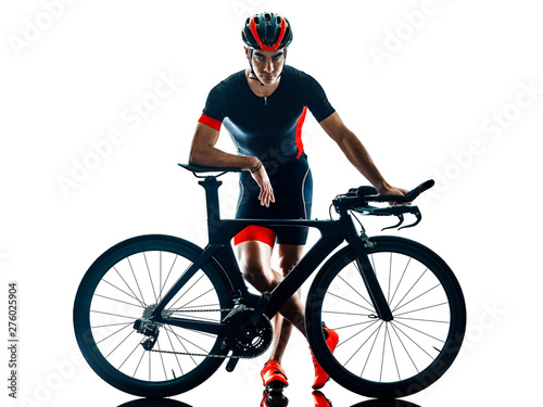 Fototapeta Naklejka Na Ścianę i Meble -  triathlete triathlon Cyclist cycling in studio silhouette shadow isolated on white background