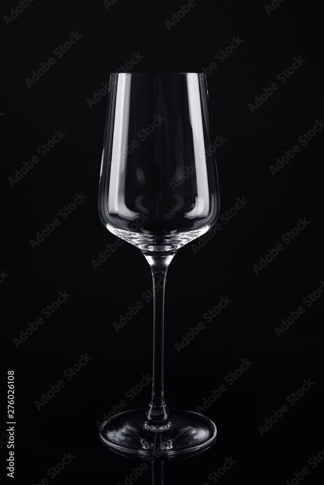 New empty wine glass on black background New empty wine glass on black background