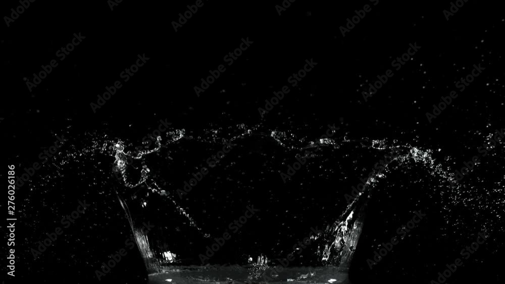 Super slow motion of splashing water isolated on black background. Filmed on very high speed camera, 1000 fps. Super slow motion of splashing water isolated on black background. Filmed on very high speed camera, 1000 fps.