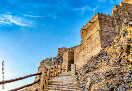 Stone staircase to the famous Muttrah Fort with blue sky background. From Muscat  Oman.