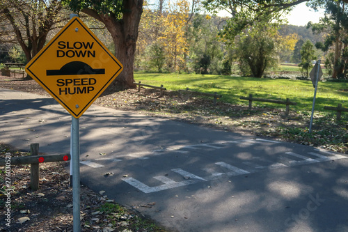 Photography Speed Hump Road sign warning to Slow Down
