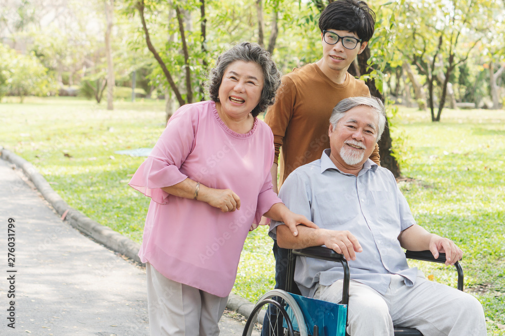 Happy asian family. Grandson take care grandma in the park. Happy asian family. Grandson take care grandma in the park.