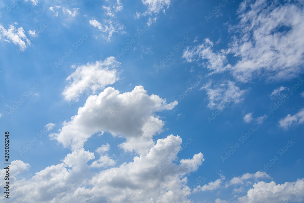 Sunny blue sky with lots of beautiful clouds