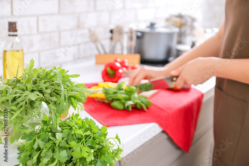 Different fresh herbs on table in kitchen