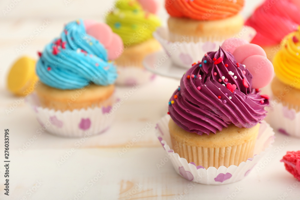 Sweet tasty cupcake on light table