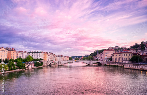 A view of Lyon, France along the Saône river at sunset. © Jbyard