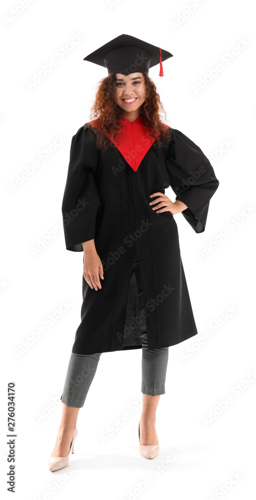 Young African-American student in bachelor robe on white background Young African-American student in bachelor robe on white background