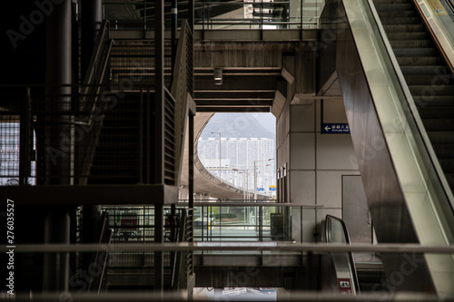 The stairs in the Hong Kong Airport building look out onto the expressway.