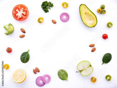 Food background and salad concept with raw ingredients flat lay on white wooden background.