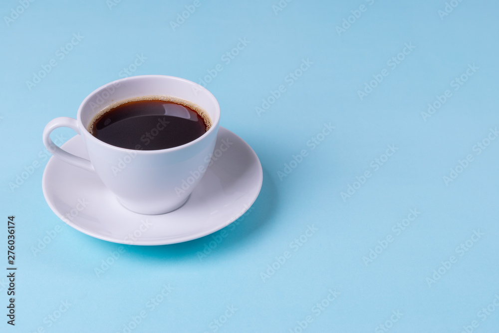 Black Coffee on pale blue table background. Copy space for text. Black Coffee on pale blue table background. Copy space for text.