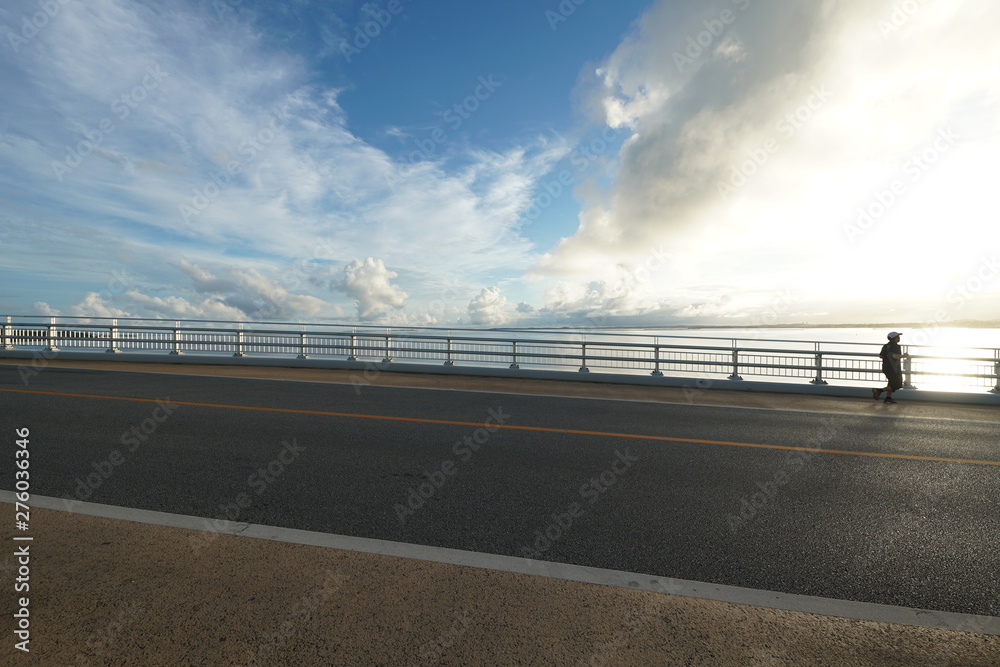 Miyako island, Japan - June 26, 2019: Irabu bridge, the longest charge-free bridge in Japan, connecting Miyako island and Irabu island just after the sunrise