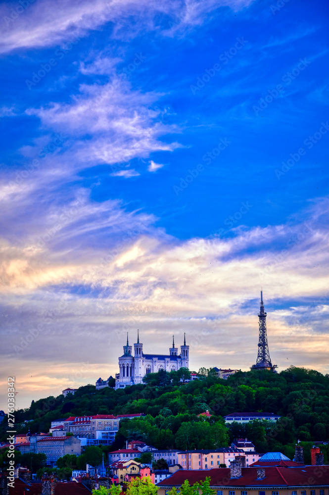 Lyon, France and the Basilica of Notre-Dame de Fourvière at sunset.