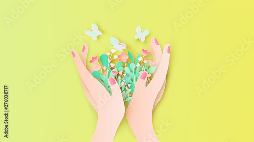 Beautiful girl's hand holding flower bouquet with butterflies flying around. Women and flower. paper cut and craft style. vector, illustration.