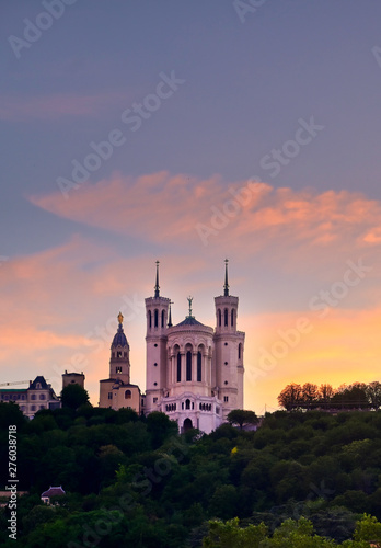 Lyon, France and the Basilica of Notre-Dame de Fourvière at sunset.
