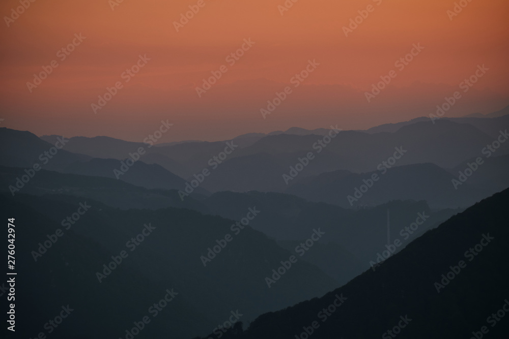 layers of hills in the sunset with Trbovlje chimney - Slovenia